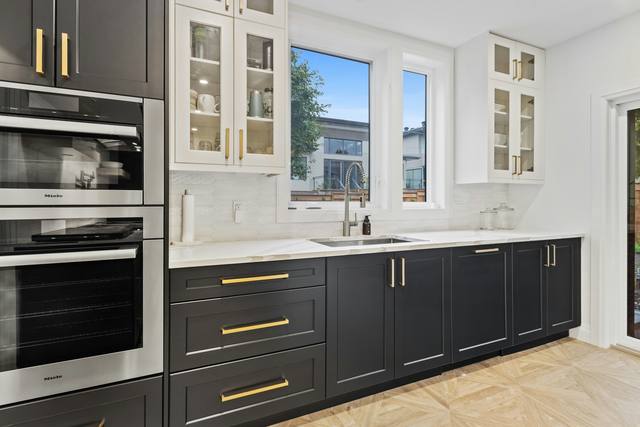 Dark cabinets · brass hardware