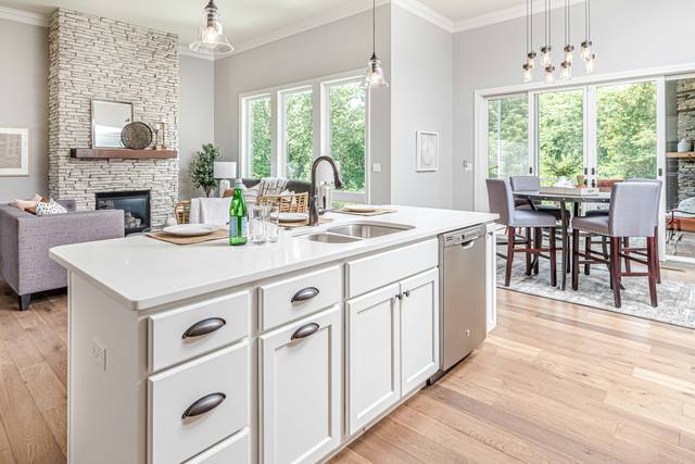 White kitchen · stone fireplace