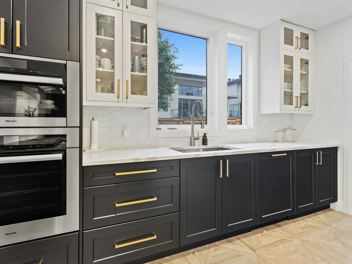 Dark cabinets · brass hardware