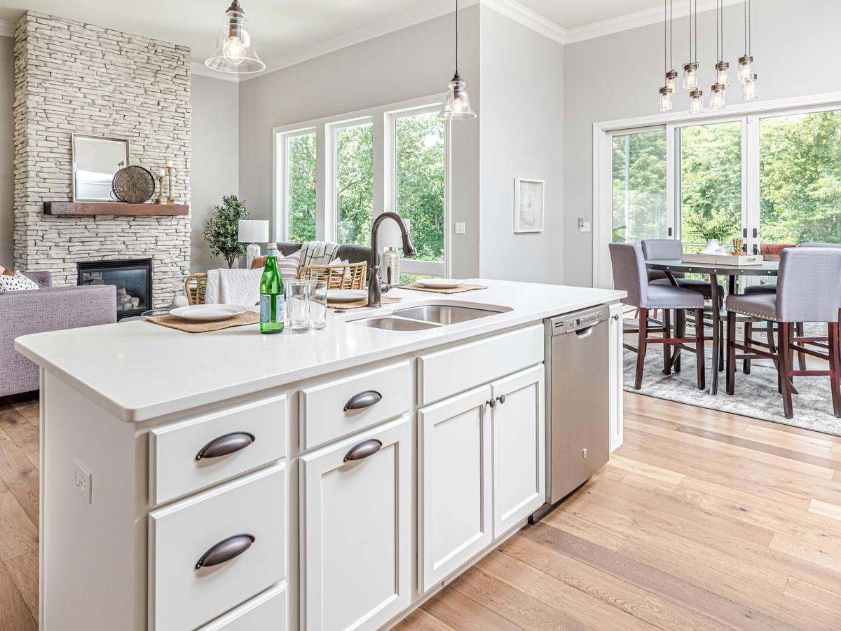 White kitchen · stone fireplace